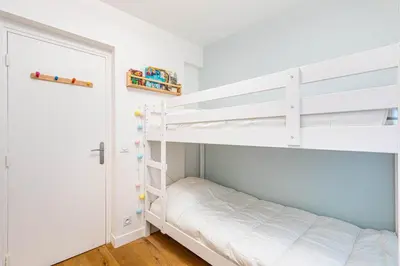Un ou plusieurs lits dans un hébergement de l'établissement GuestReady - A lovely gem near Paris
