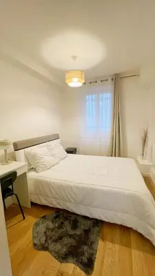 Un ou plusieurs lits dans un hébergement de l'établissement Lux Home Le Marais