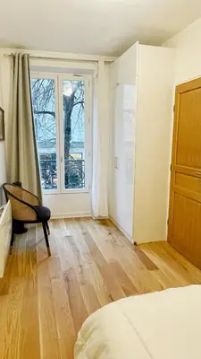 Un ou plusieurs lits dans un hébergement de l'établissement Lux Home Le Marais