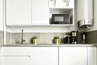 Cuisine ou kitchenette dans l'établissement Luxury suite near Eiffel Tower