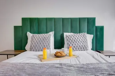 Un ou plusieurs lits dans un hébergement de l'établissement COSY Appartement Paris Centre