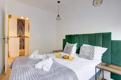 Un ou plusieurs lits dans un hébergement de l'établissement COSY Appartement Paris Centre