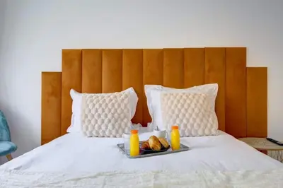 Un ou plusieurs lits dans un hébergement de l'établissement COSY Appartement Paris Centre