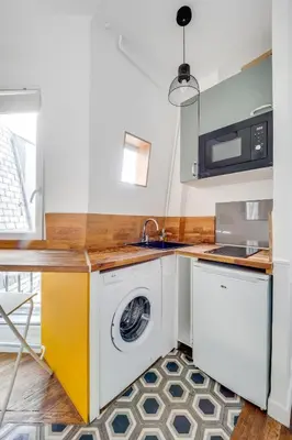 Cuisine ou kitchenette dans l'établissement Appartement neuf à 20 des Champs Élysées