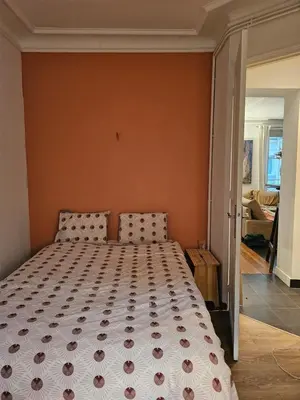Un ou plusieurs lits dans un hébergement de l'établissement Buttes Chaumont apartement