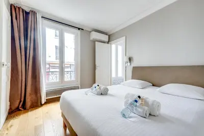 Un ou plusieurs lits dans un hébergement de l'établissement AC & 10min from Marais l Center of Paris