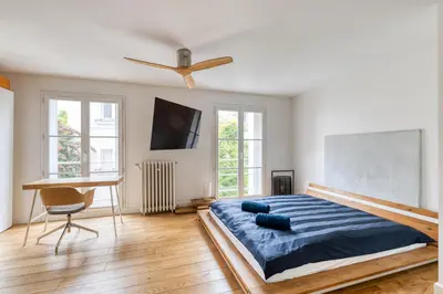 Un ou plusieurs lits dans un hébergement de l'établissement Parisian Loft & Secret Garden