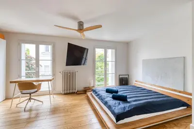 Un ou plusieurs lits dans un hébergement de l'établissement Parisian Loft & Secret Garden