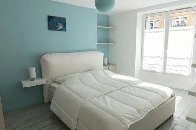 Un ou plusieurs lits dans un hébergement de l'établissement Cozy apartment in Le Marais