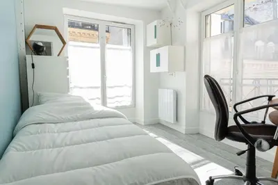 Un ou plusieurs lits dans un hébergement de l'établissement Cozy apartment in Le Marais