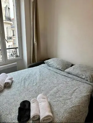 Un ou plusieurs lits dans un hébergement de l'établissement Lumineux et agréable