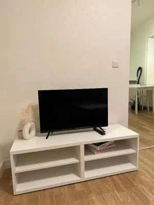 Télévision ou salle de divertissement dans l'établissement Lumineux et agréable