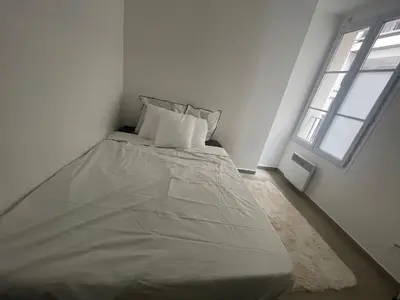 Un ou plusieurs lits dans un hébergement de l'établissement appartement au centre de Paris, 2ème arrondissement