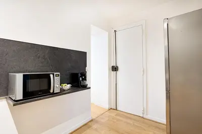 Cuisine ou kitchenette dans l'établissement Center Paris République Appartment
