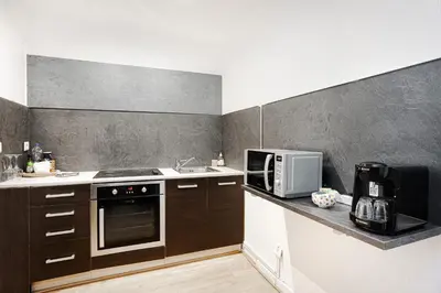 Cuisine ou kitchenette dans l'établissement Center Paris République Appartment