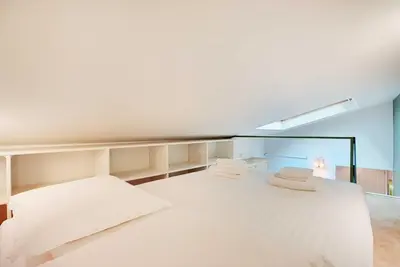 Un ou plusieurs lits dans un hébergement de l'établissement Chic and Cosy Apartment-Canal Saint Martin