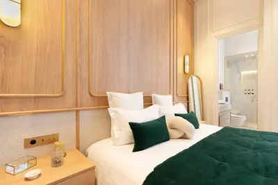 Un ou plusieurs lits dans un hébergement de l'établissement Maison Galante's apartments with Services in Louvre - Rue des Déchargeurs