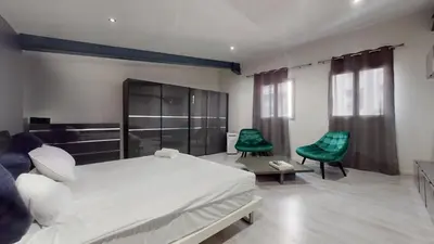 Un ou plusieurs lits dans un hébergement de l'établissement Loft cosy