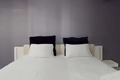 Un ou plusieurs lits dans un hébergement de l'établissement Loft cosy