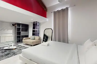 Un ou plusieurs lits dans un hébergement de l'établissement Loft cosy