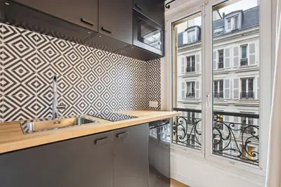 Cuisine ou kitchenette dans l'établissement Studio Arc de Triomphe
