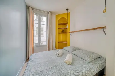 Un ou plusieurs lits dans un hébergement de l'établissement Apartment in Paris 17th District