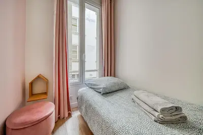 Un ou plusieurs lits dans un hébergement de l'établissement Apartment in Paris 17th District