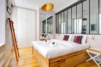 Un ou plusieurs lits dans un hébergement de l'établissement Apartment in le marais