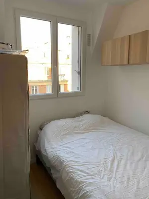 Un ou plusieurs lits dans un hébergement de l'établissement Paris apartment with room near Tour Eiffel