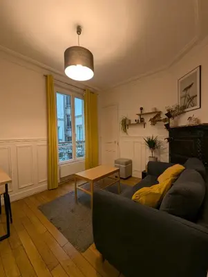 Coin salon dans l'établissement Apartment 2 steps from Montmartre