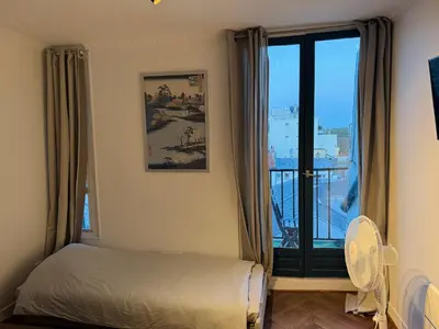 Un ou plusieurs lits dans un hébergement de l'établissement Fantastic apartement & terrace Paris Montparnasse