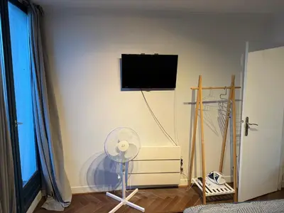 Télévision ou salle de divertissement dans l'établissement Fantastic apartement & terrace Paris Montparnasse