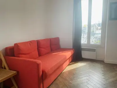 Coin salon dans l'établissement Fantastic apartement & terrace Paris Montparnasse