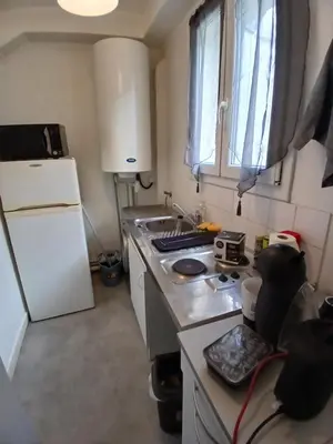 Cuisine ou kitchenette dans l'établissement Detente
