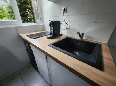 Cuisine ou kitchenette dans l'établissement Appartement 2 pieces agréable lumineux et calme