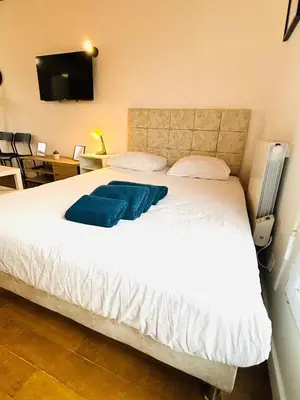 Un ou plusieurs lits dans un hébergement de l'établissement Appartement porte de Saint Ouen
