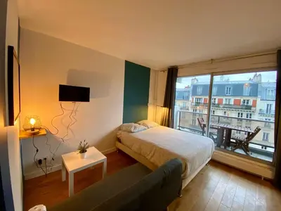 Un ou plusieurs lits dans un hébergement de l'établissement Appartement Censier Monge