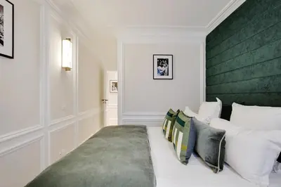 Un ou plusieurs lits dans un hébergement de l'établissement Pick A Flat's apartment in Opéra- Rue Lafitte
