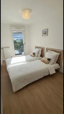 Un ou plusieurs lits dans un hébergement de l'établissement Le Central - Bel appartement lumineux proche Paris