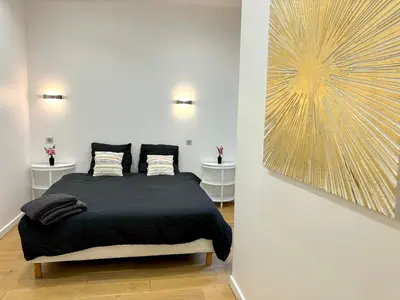 Un ou plusieurs lits dans un hébergement de l'établissement L'appartement Murat