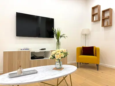 Télévision ou salle de divertissement dans l'établissement L'appartement Murat