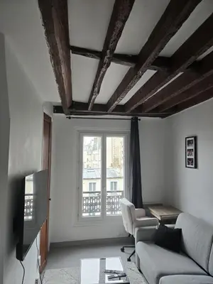Coin salon dans l'établissement Cosy 1-bedroom apartment - Paris 17