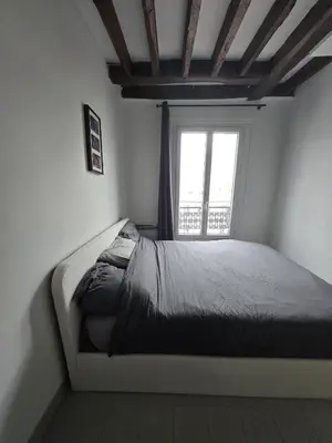Un ou plusieurs lits dans un hébergement de l'établissement Cosy 1-bedroom apartment - Paris 17