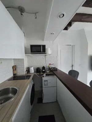Cuisine ou kitchenette dans l'établissement Cosy 1-bedroom apartment - Paris 17