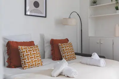 Un ou plusieurs lits dans un hébergement de l'établissement Studio cozy à Grenelle