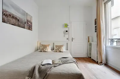 Un ou plusieurs lits dans un hébergement de l'établissement Prestige Avenue Kléber