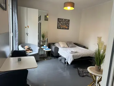 Un ou plusieurs lits dans un hébergement de l'établissement Cosy studio Beaubourg paris centre