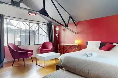 Un ou plusieurs lits dans un hébergement de l'établissement Loft Unique au Design Contemporain