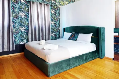 Un ou plusieurs lits dans un hébergement de l'établissement Loft Unique au Design Contemporain