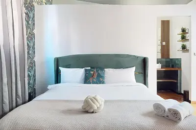 Un ou plusieurs lits dans un hébergement de l'établissement Loft Unique au Design Contemporain